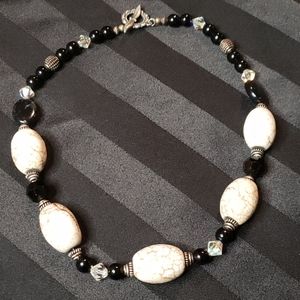 Handmade white and black beaded necklace.